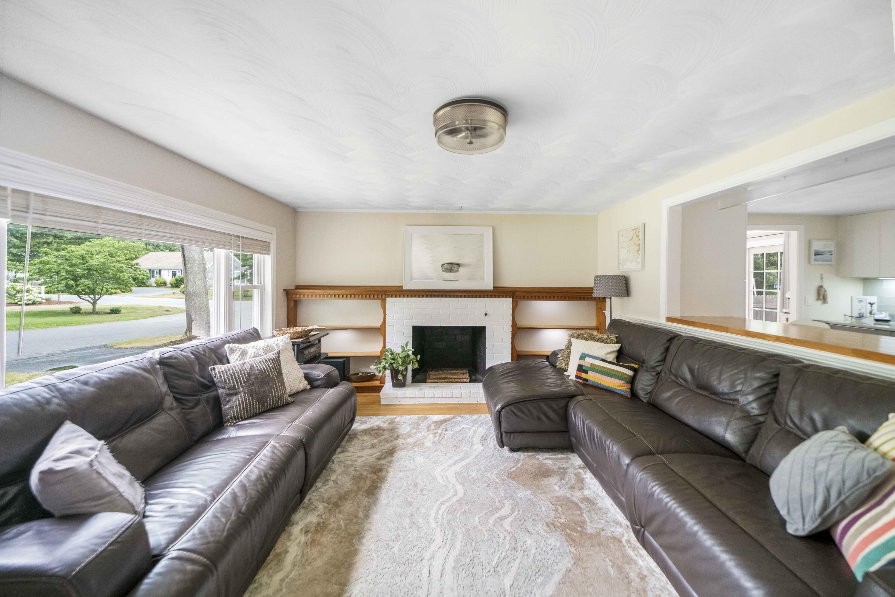 7 Arbeta Road Hyannis, MA 02601 - Photo 30 of 54 a living room with furniture and a fireplace