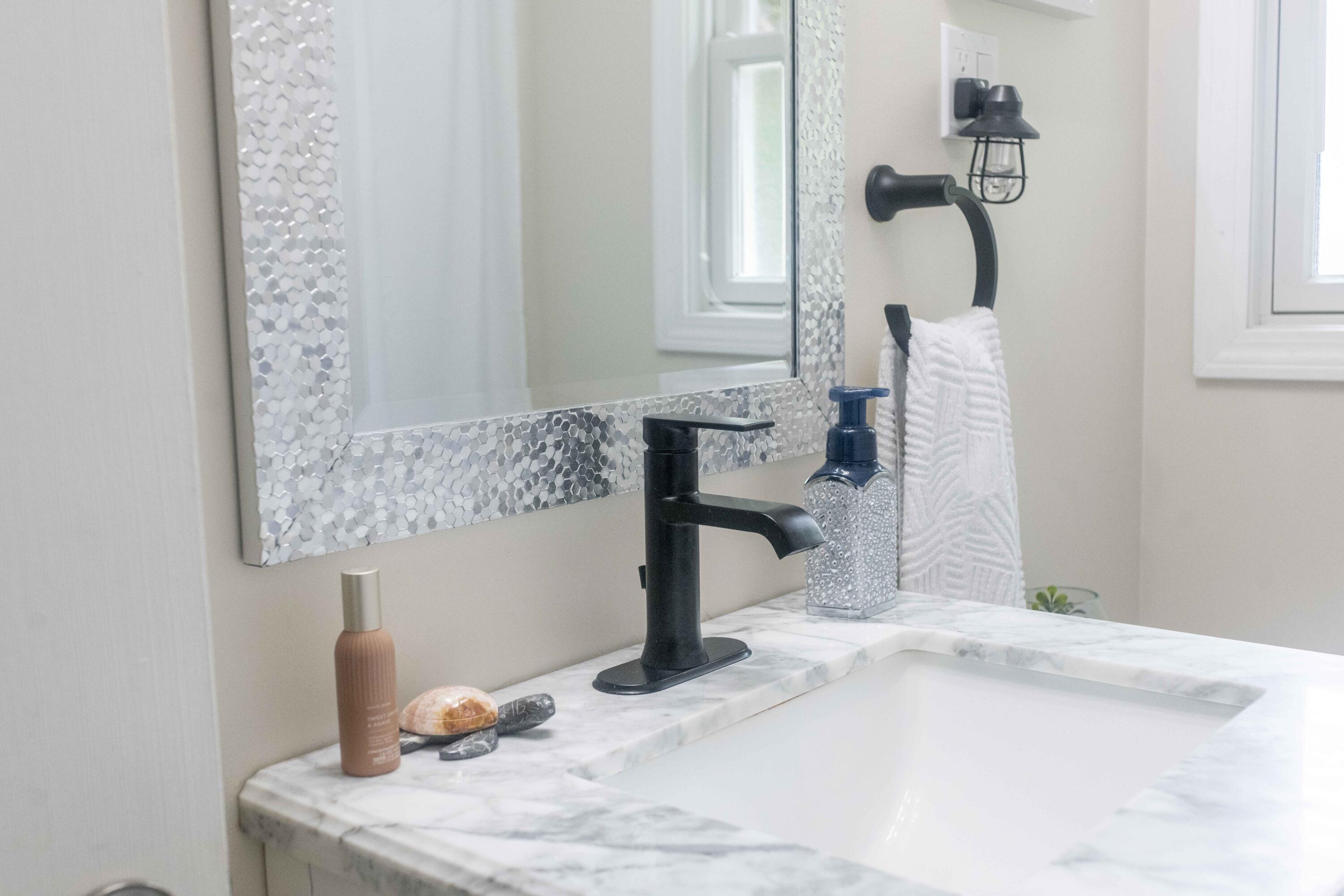 7 Arbeta Road Hyannis, MA 02601 - Photo 32 of 54 a bathroom with a sink and a mirror