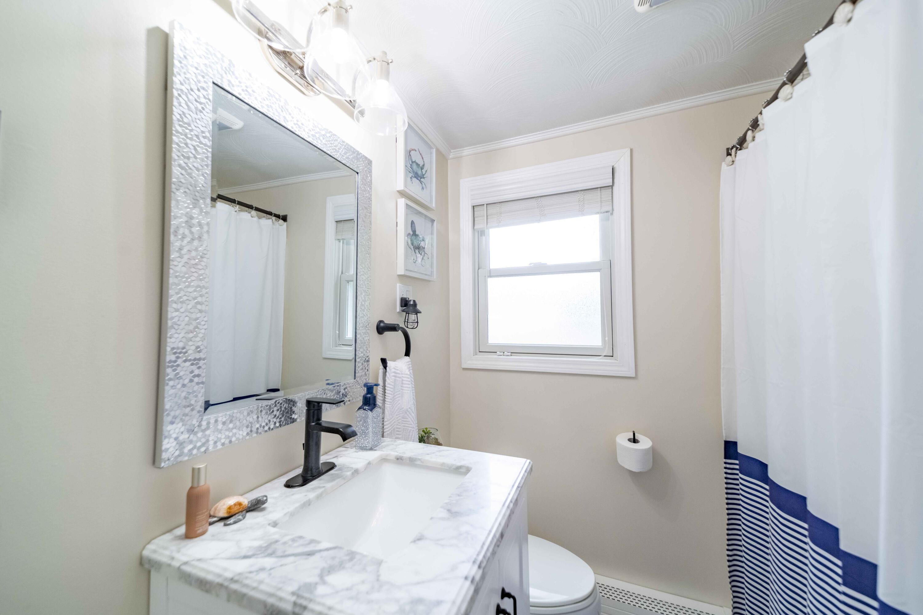 7 Arbeta Road Hyannis, MA 02601 - Photo 33 of 54 a bathroom with a sink toilet and tub