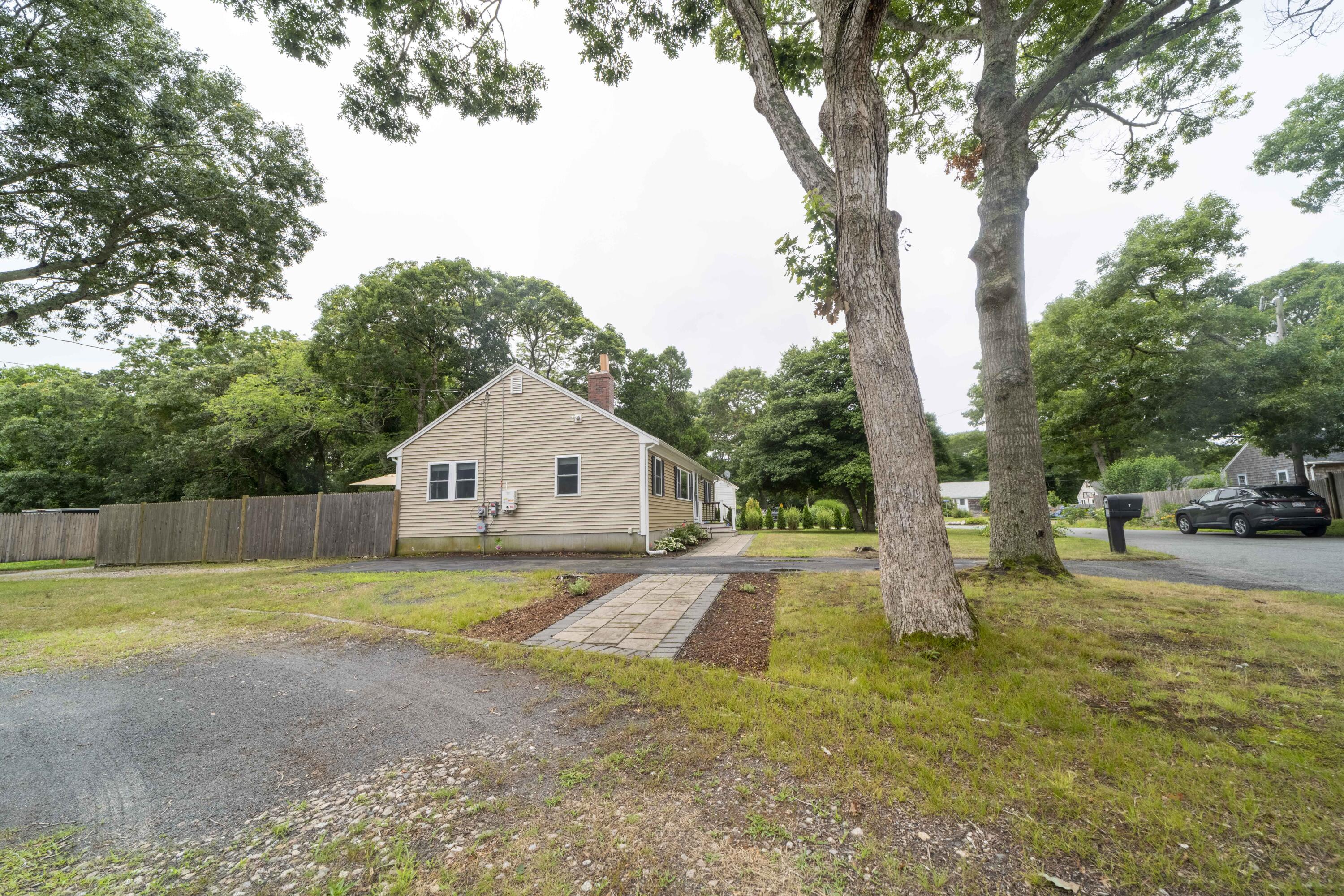 7 Arbeta Road Hyannis, MA 02601 - Photo 39 of 54 a view of a house with a yard and large trees