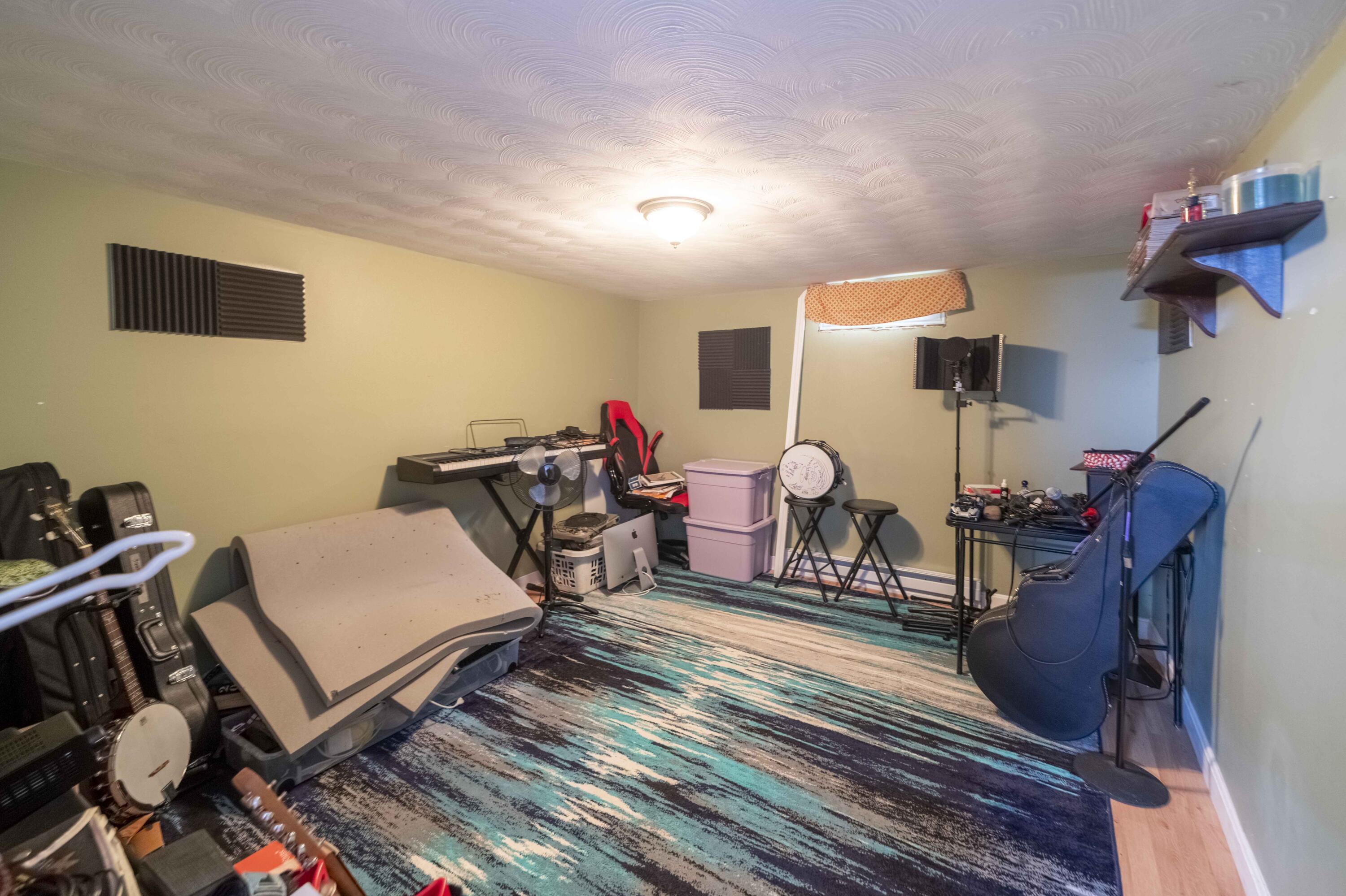 7 Arbeta Road Hyannis, MA 02601 - Photo 50 of 54 a living room with furniture a flat screen tv and gym equipment