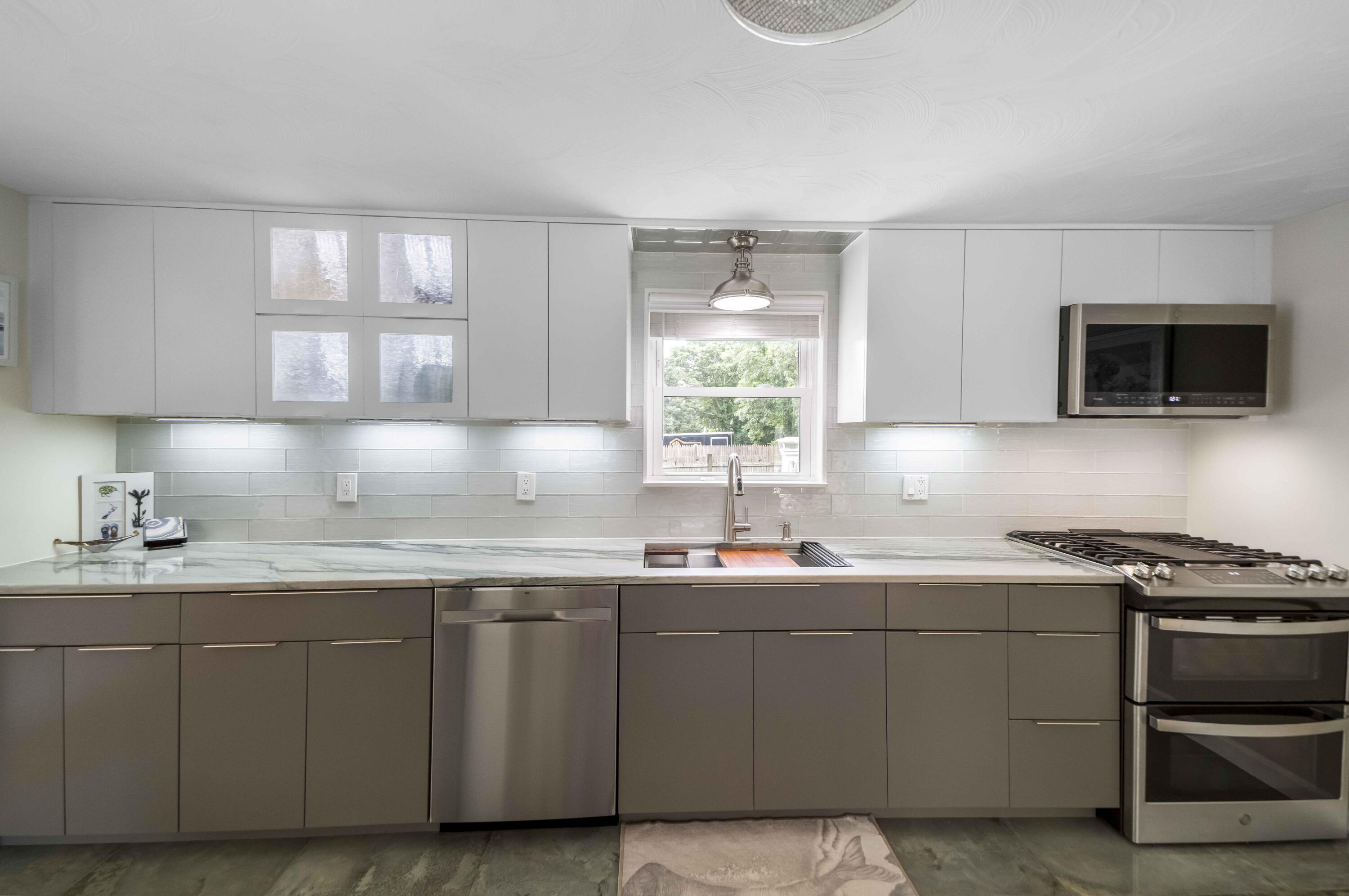7 Arbeta Road Hyannis, MA 02601 - Photo 5 of 54 a kitchen with stainless steel appliances a sink a stove and a microwave