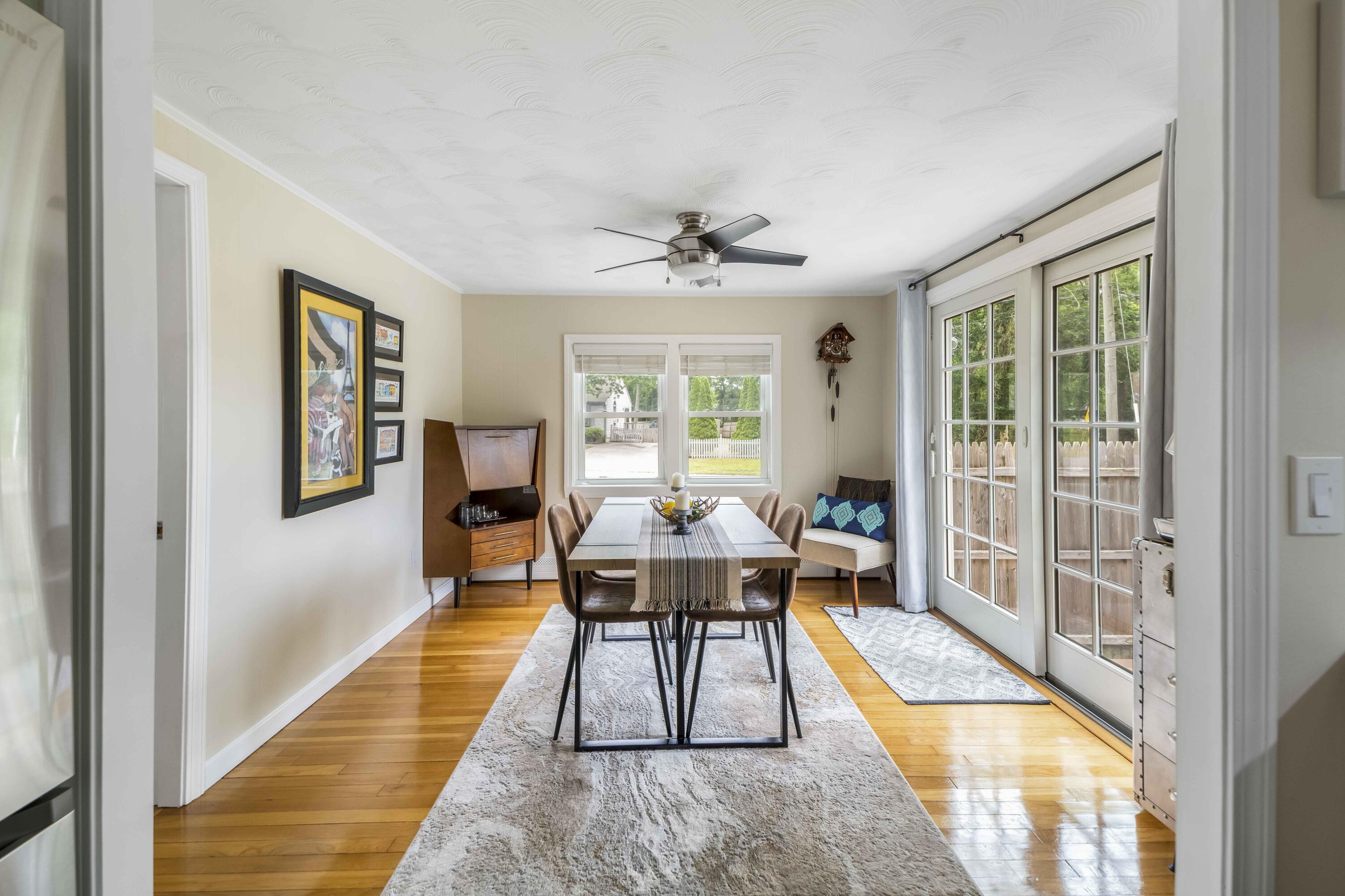 7 Arbeta Road Hyannis, MA 02601 - Photo 8 of 54 a living room with furniture two window and a table