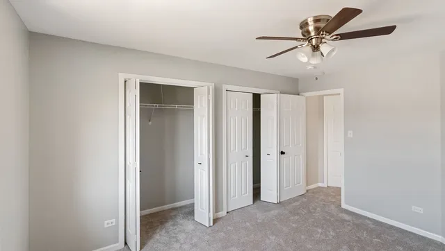 a view of a livingroom with a ceiling fan