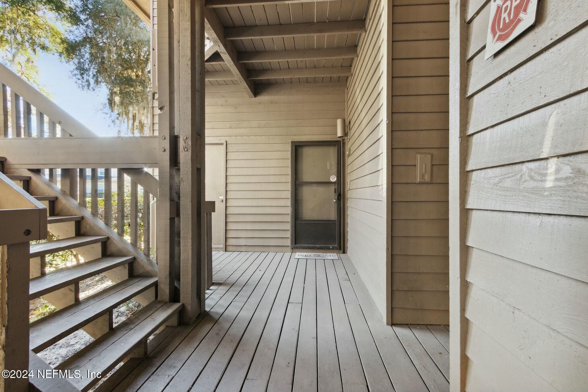3165 Ravines Road, Unit 3601 Middleburg, FL 32068 - Photo 3 of 23 a view of a balcony with wooden floor