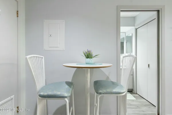 a view of kitchen with furniture and wooden floor