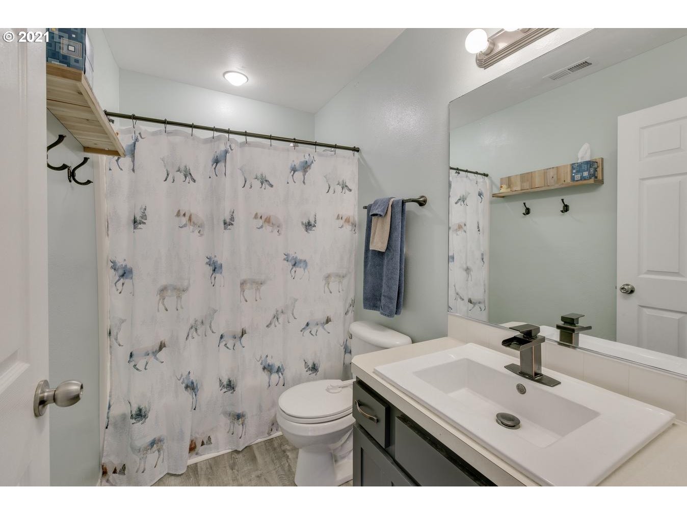 39392 Amherst Street Sandy, OR 97055 - Photo 22 of 30 a bathroom with a sink toilet a mirror and shower