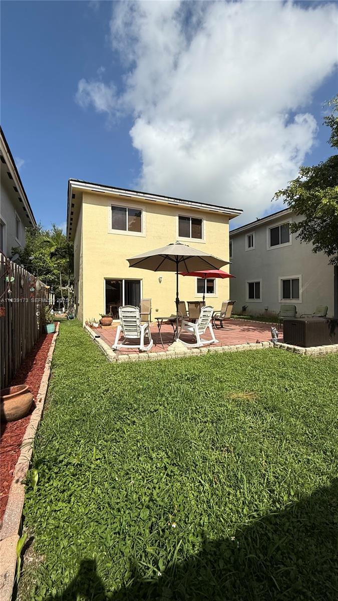 232 Southeast 32nd Terrace Homestead, FL 33033 - Photo 11 of 11 a couple of table and chairs in front of house
