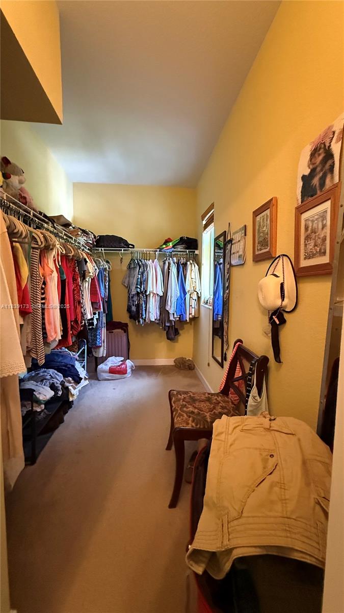 232 Southeast 32nd Terrace Homestead, FL 33033 - Photo 6 of 11 a bedroom with bed and gym equipment