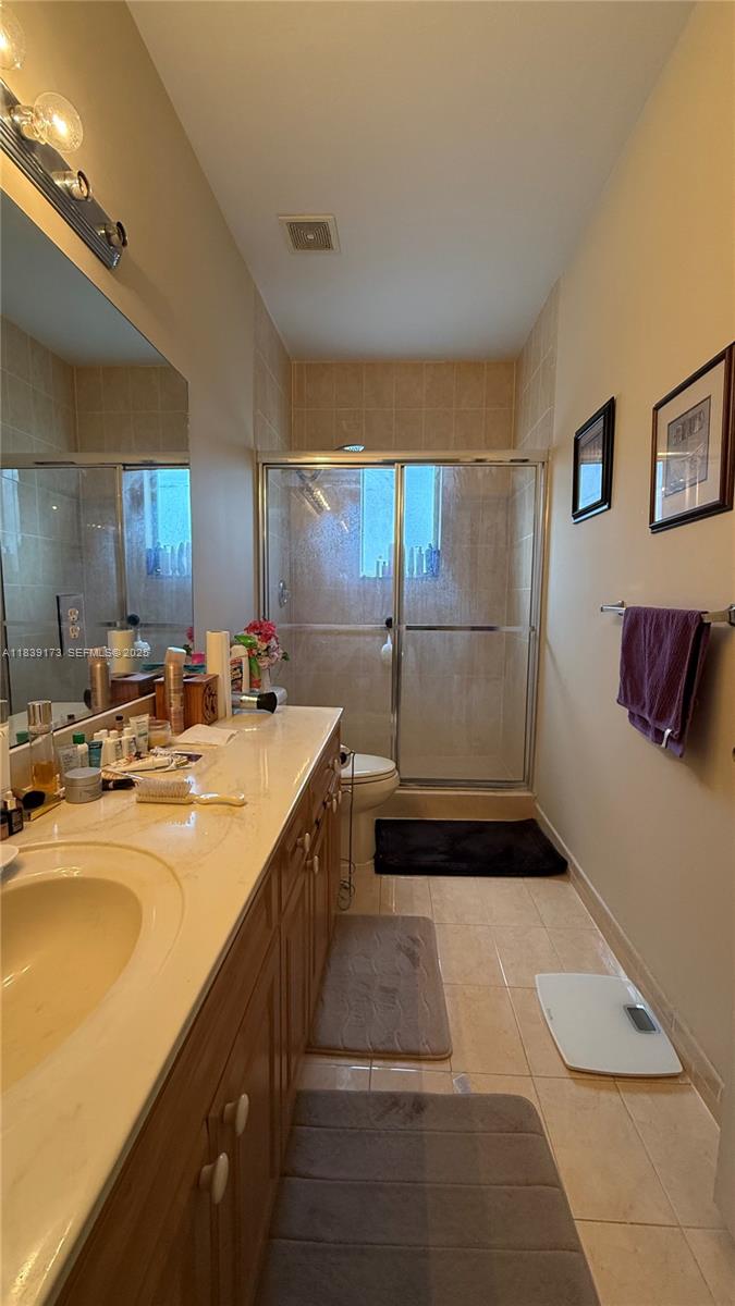 232 Southeast 32nd Terrace Homestead, FL 33033 - Photo 7 of 11 a kitchen with sink and mirror