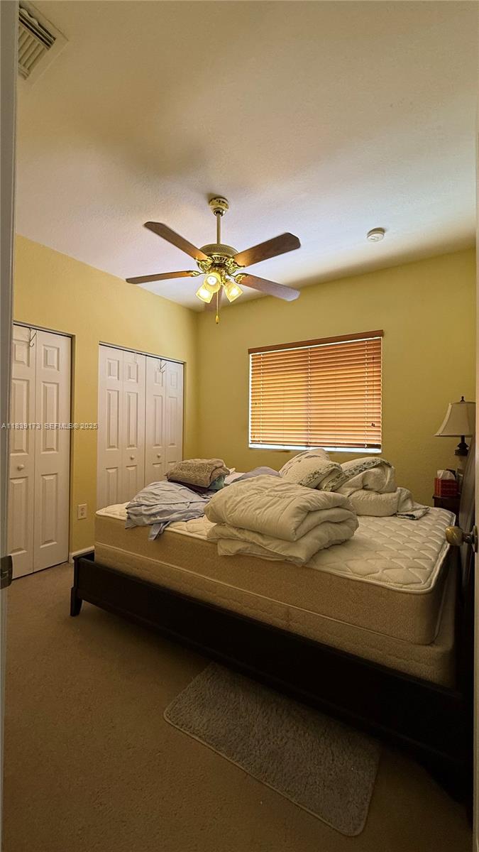 232 Southeast 32nd Terrace Homestead, FL 33033 - Photo 10 of 11 a bedroom with a bed and ceiling fan