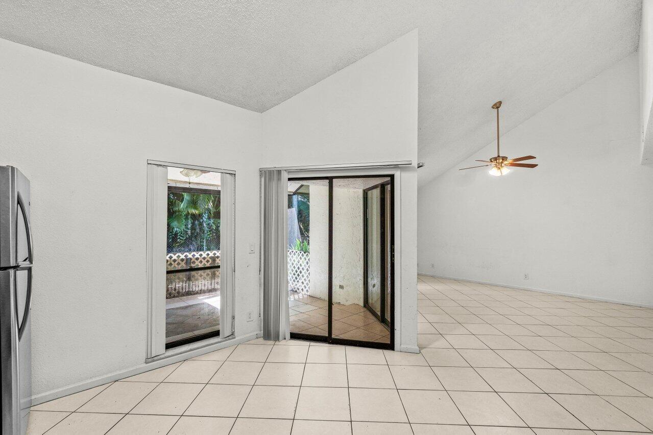 9308 Ketay Circle Boca Raton, FL 33428 - Photo 11 of 35 an empty room with windows