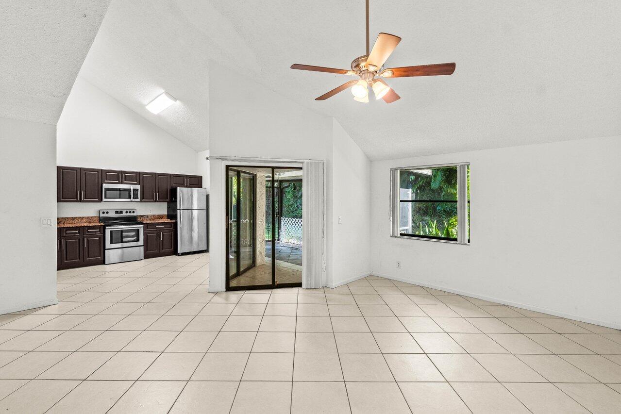9308 Ketay Circle Boca Raton, FL 33428 - Photo 13 of 35 a view of an empty room with window and cabinet