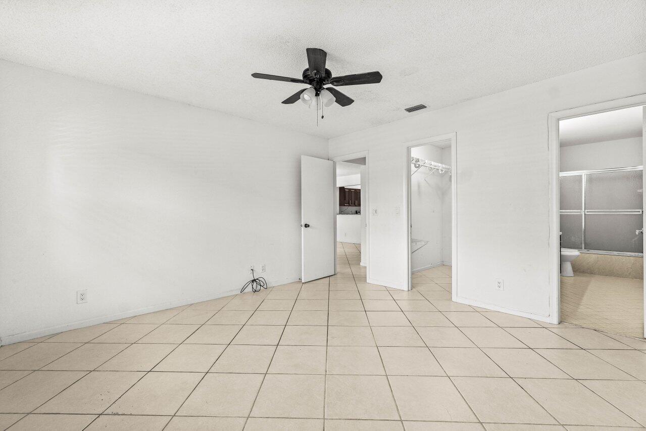 9308 Ketay Circle Boca Raton, FL 33428 - Photo 18 of 35 a view of an empty room and window
