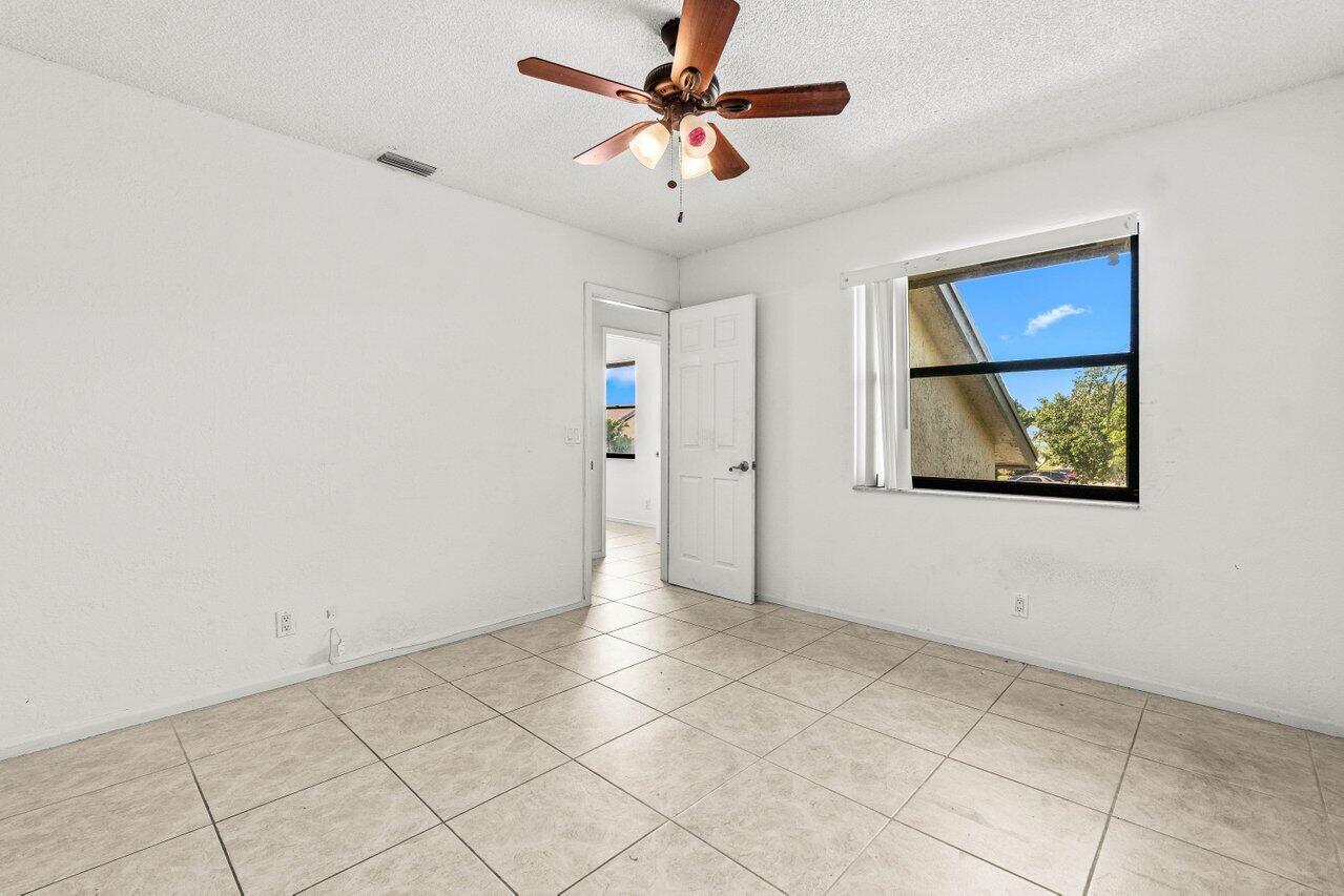 9308 Ketay Circle Boca Raton, FL 33428 - Photo 26 of 35 a view of an empty room with a window