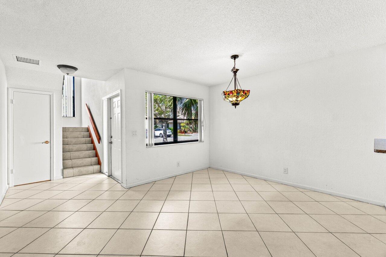 9308 Ketay Circle Boca Raton, FL 33428 - Photo 5 of 35 an empty room with windows