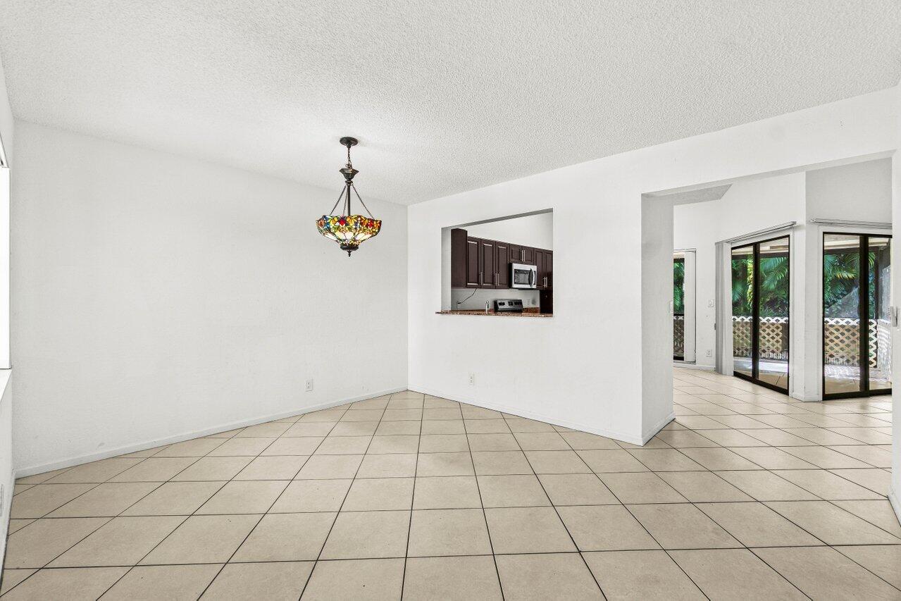 9308 Ketay Circle Boca Raton, FL 33428 - Photo 6 of 35 a view of an entryway with wooden floor