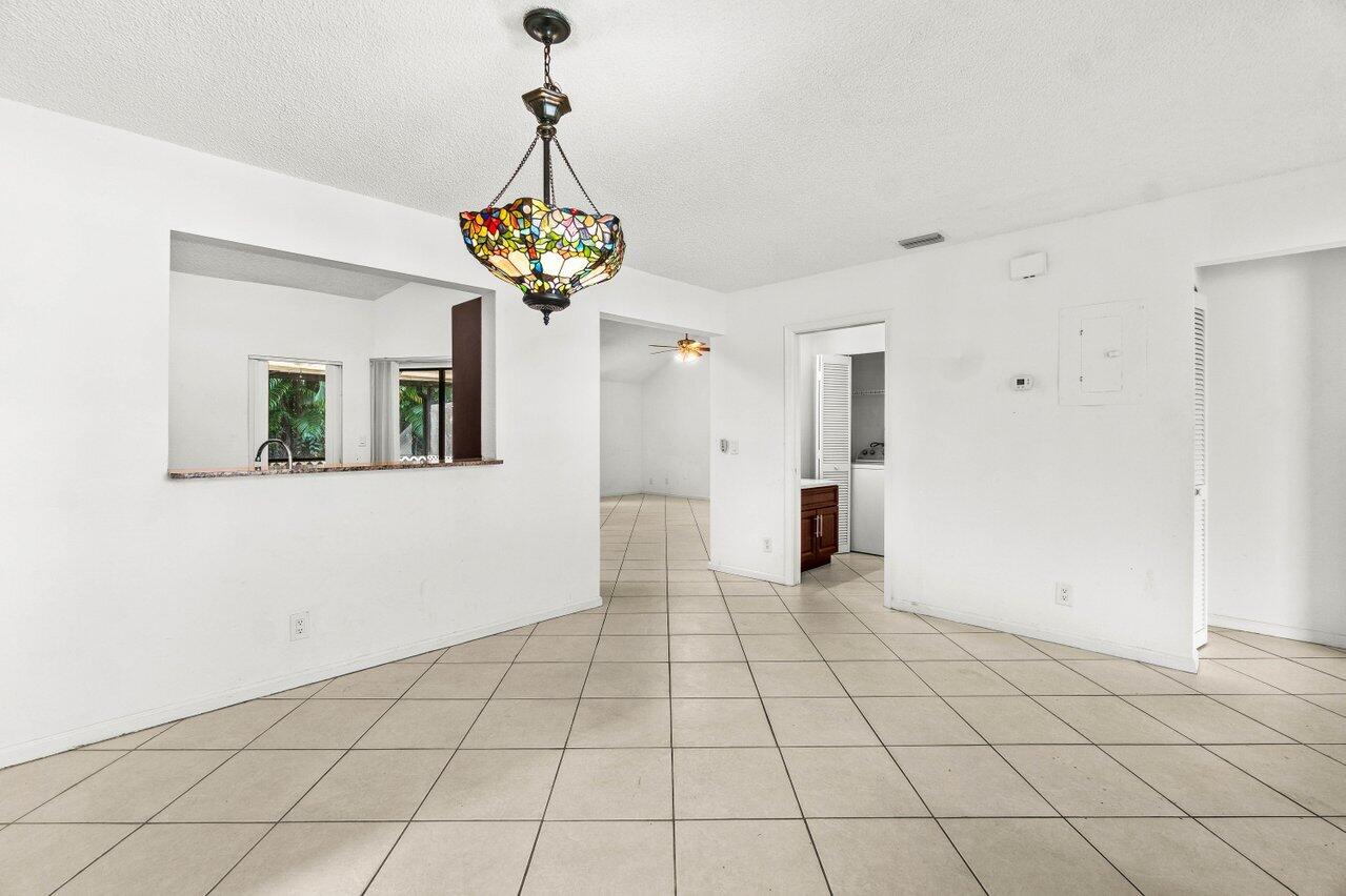 9308 Ketay Circle Boca Raton, FL 33428 - Photo 7 of 35 a view of an entryway with a chandelier