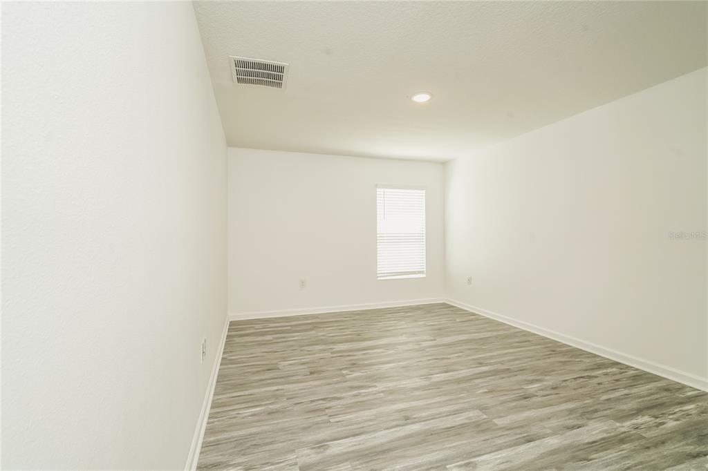 1473 Lucerne Loop Road Northeast Winter Haven, FL 33881 - Photo 23 of 25 a view of an empty room
