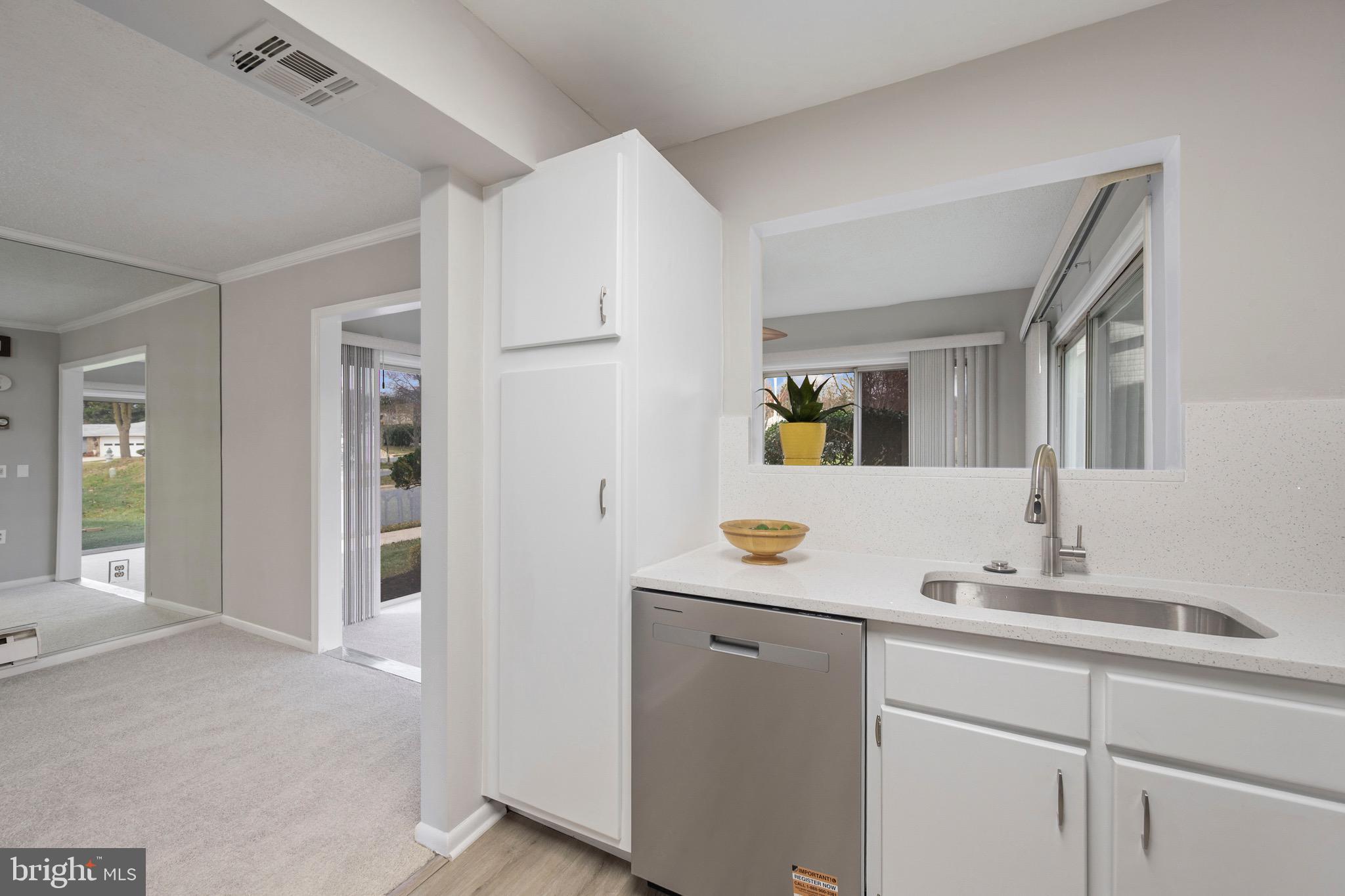 15561 Prince Frederick Way, Unit 114A Silver Spring, MD 20906 - Photo 14 of 32 a bathroom with a sink and a mirror