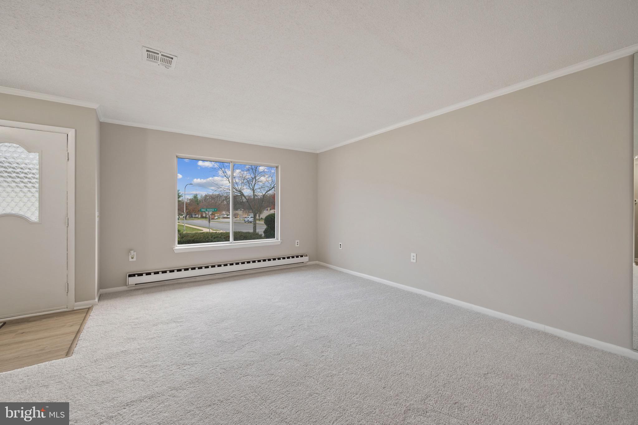 15561 Prince Frederick Way, Unit 114A Silver Spring, MD 20906 - Photo 18 of 32 an empty room with windows