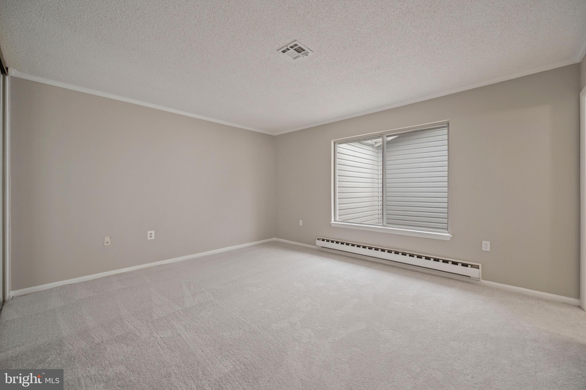 15561 Prince Frederick Way, Unit 114A Silver Spring, MD 20906 - Photo 29 of 32 an empty room with a window