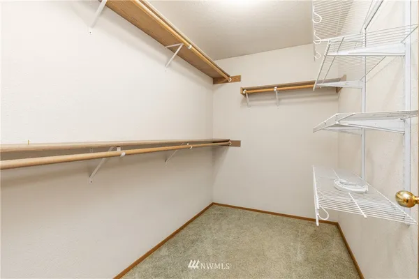 a view of an empty walk in closet