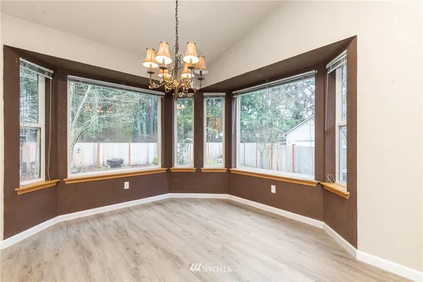 a view of empty room with a large window