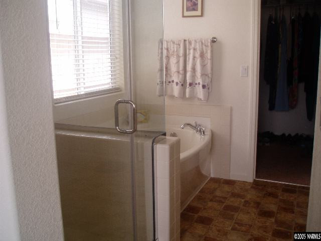 10645 Copper Lake Drive Reno, NV 89521 - Photo 6 of 8 a bathroom with a sink and a mirror