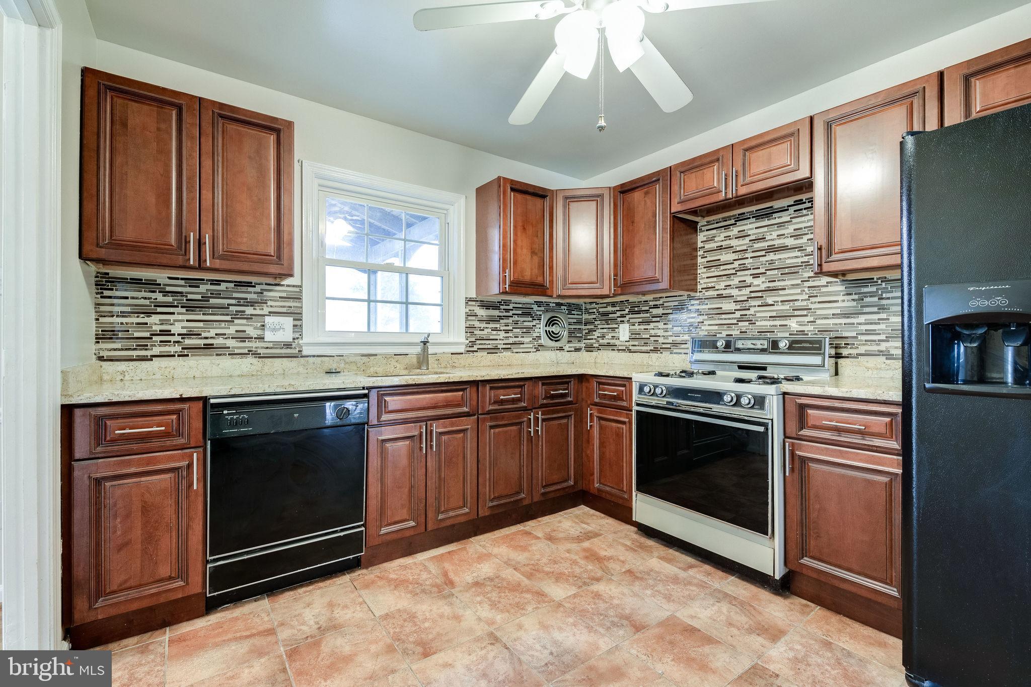 7723 Hayfield Road Alexandria, VA 22315 - Photo 9 of 28 Kitchen boasts new cabinets and granite countertop