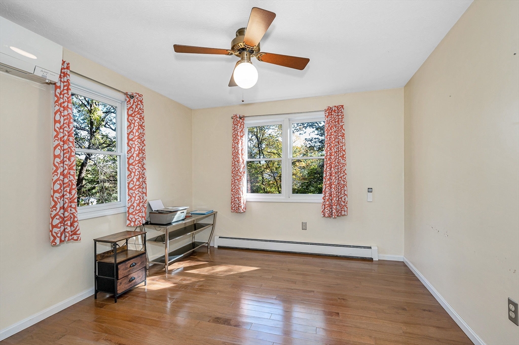 38 Pine Ridge Drive Ayer, MA 01432 - Photo 13 of 42 a view of room with hardwood floor ceiling fan and window