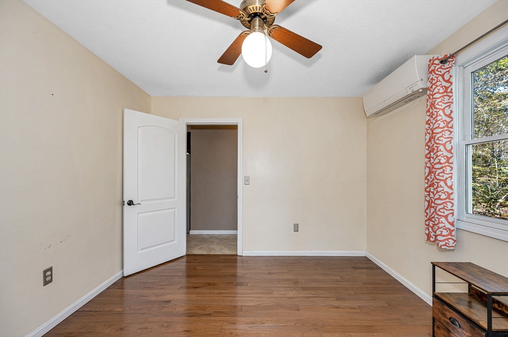 38 Pine Ridge Drive Ayer, MA 01432 - Photo 15 of 42 wooden floor in an empty room with a window
