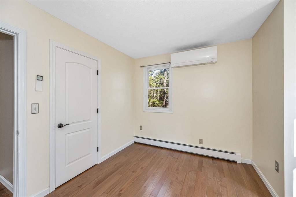 38 Pine Ridge Drive Ayer, MA 01432 - Photo 17 of 42 wooden floor in an empty room