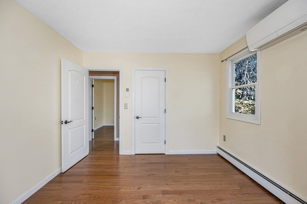 38 Pine Ridge Drive Ayer, MA 01432 - Photo 18 of 42 a view of an empty room and wooden floor