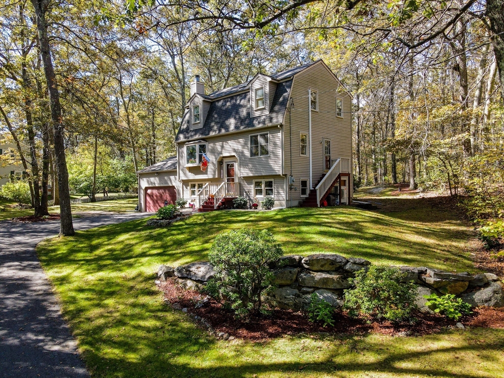 38 Pine Ridge Drive Ayer, MA 01432 - Photo 2 of 42 a view of a house with a yard potted plants and large tree