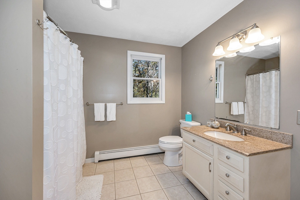 38 Pine Ridge Drive Ayer, MA 01432 - Photo 21 of 42 a bathroom with a double vanity sink and a mirror