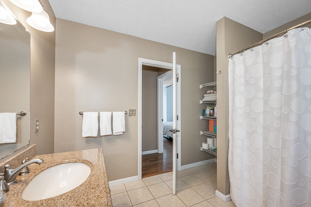 38 Pine Ridge Drive Ayer, MA 01432 - Photo 22 of 42 a bathroom with a sink and mirror