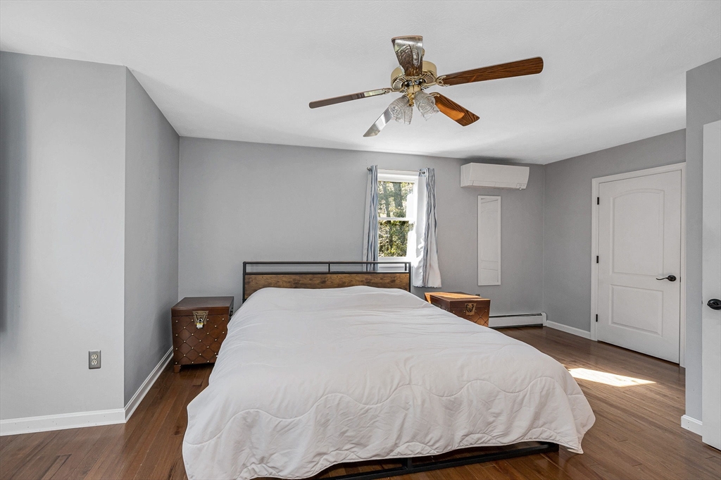 38 Pine Ridge Drive Ayer, MA 01432 - Photo 25 of 42 a bedroom with a bed and window