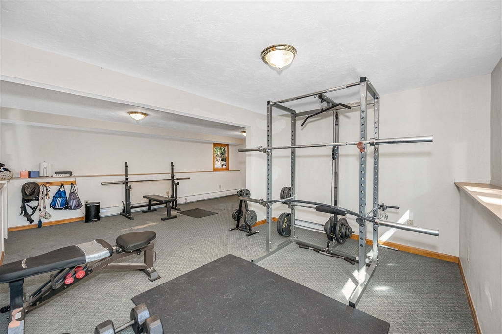 38 Pine Ridge Drive Ayer, MA 01432 - Photo 28 of 42 a room with gym equipment and a large window