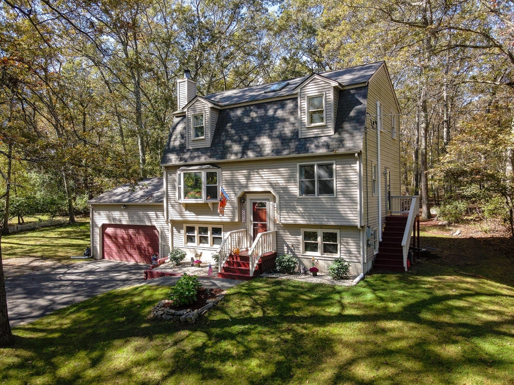 38 Pine Ridge Drive Ayer, MA 01432 - Photo 38 of 42 front view of house with a yard