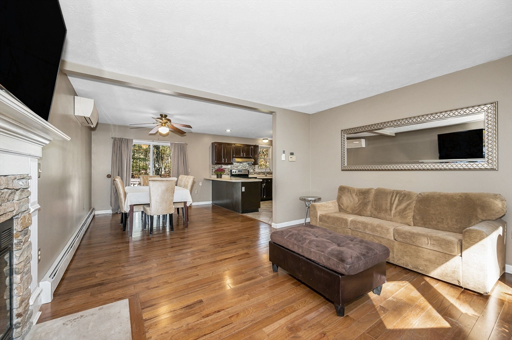 38 Pine Ridge Drive Ayer, MA 01432 - Photo 10 of 42 a living room with furniture and a fireplace