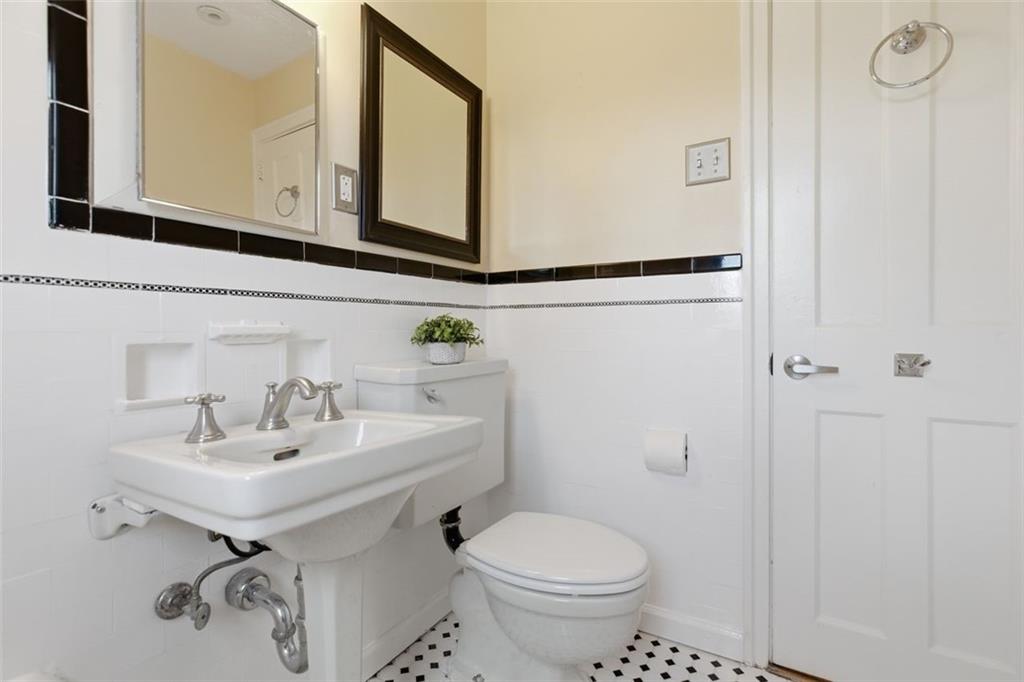 421 Olympia Road Pittsburgh, PA 15211 - Photo 23 of 34 a bathroom with a sink toilet and mirror