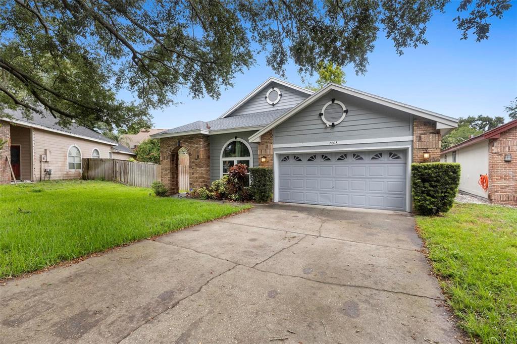 2808 Ripton Court Orlando, FL 32835 - Photo 1 of 1 a front view of a house with a yard and garage