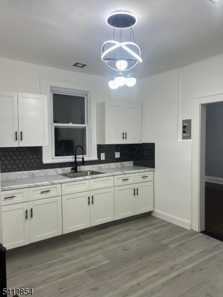 925 South Street Elizabeth, NJ 07202 - Photo 1 of 7 a kitchen with a sink cabinets and wooden floor