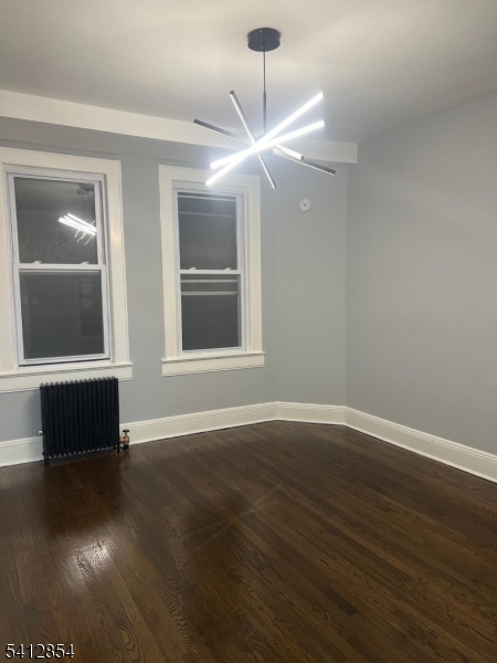 925 South Street Elizabeth, NJ 07202 - Photo 3 of 7 a view of an empty room with wooden floor and a window