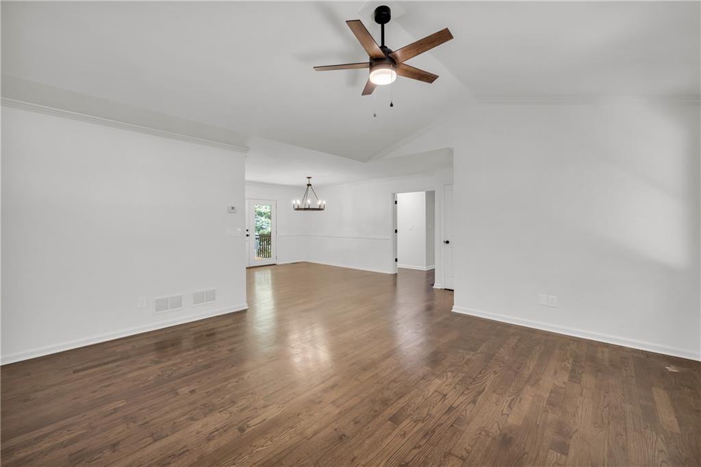 2941 Lake Hollow Road Gainesville, GA 30501 - Photo 10 of 53 an empty room with wooden floor and windows