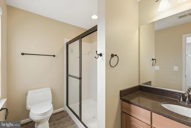 a view of a chandelier fan and entryway