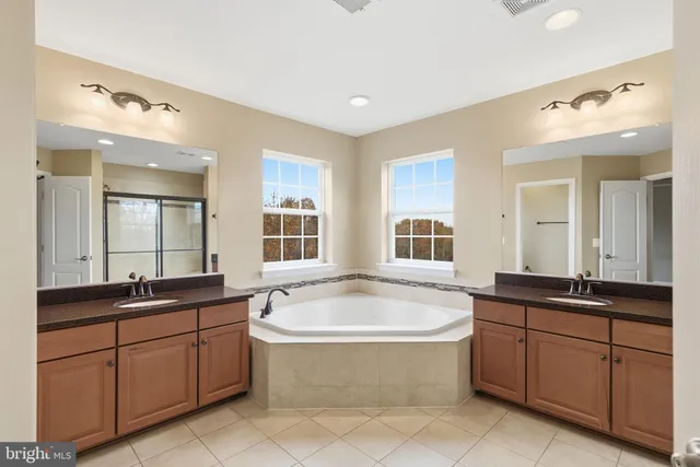 a view of a livingroom with wooden floor and a window