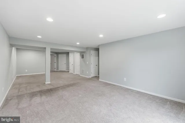 a view of a balcony with chairs and wooden floor