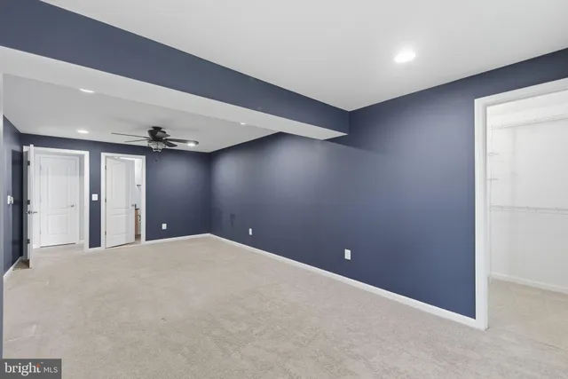 a roof deck with a dining table and chairs with wooden floor